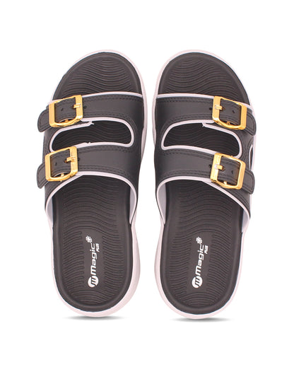 Black sandals with gold buckles on a white background